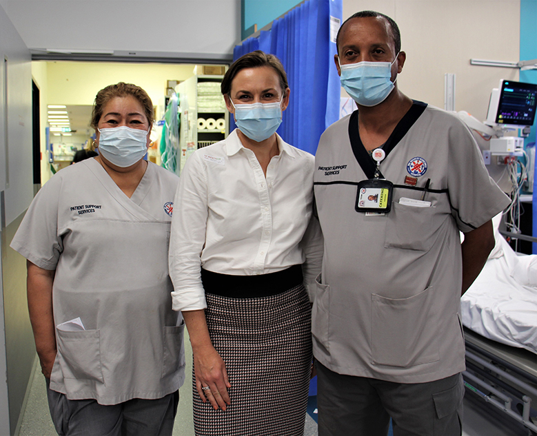 Minister with patient support services staff