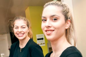 Two women smiling